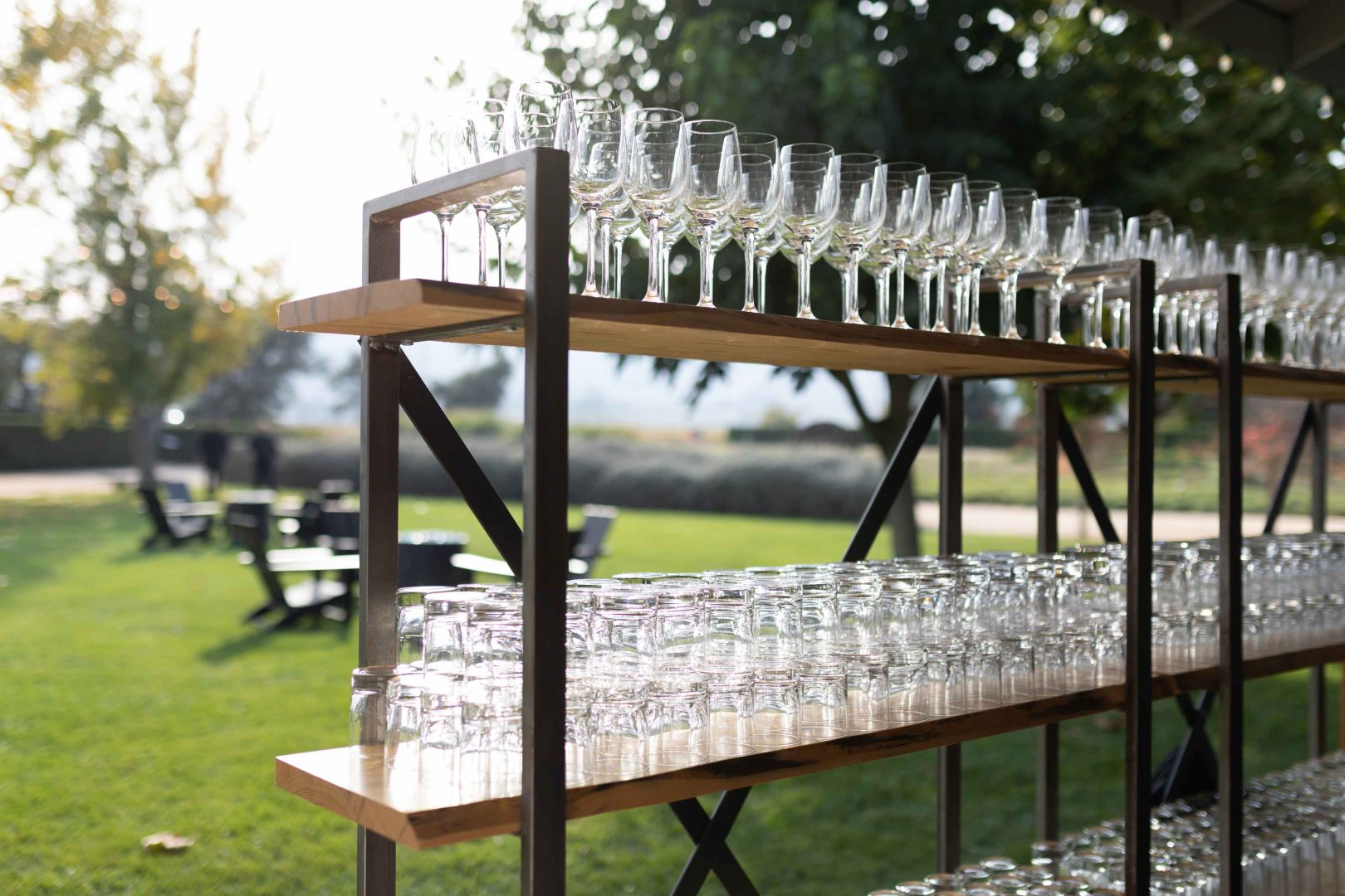 Stacks of glasses ready for use at outside Folktable catering event
